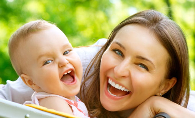 woman and baby laughing close up